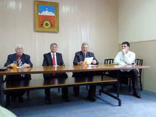 Picture 8 – At the table of the “Officials” for the reception at the dedication of the new Jarek commemorative plaque (from left): Michael Schmidt, Mr. Mandic, Michael Rettinger and “Benni,” tour guide and interpreter.